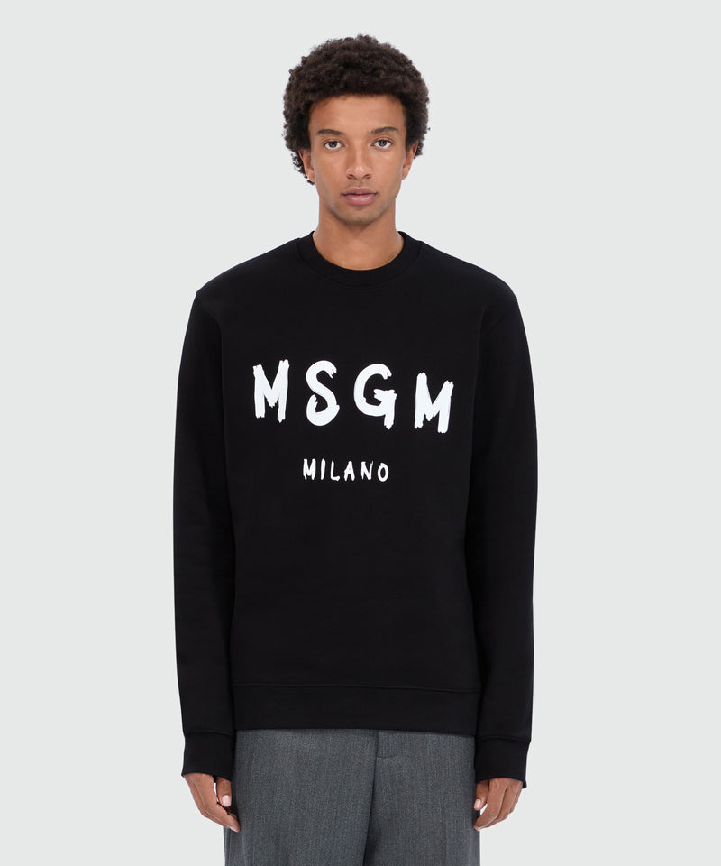 Felpa nera girocollo con logo pennellato 99 Uomo 