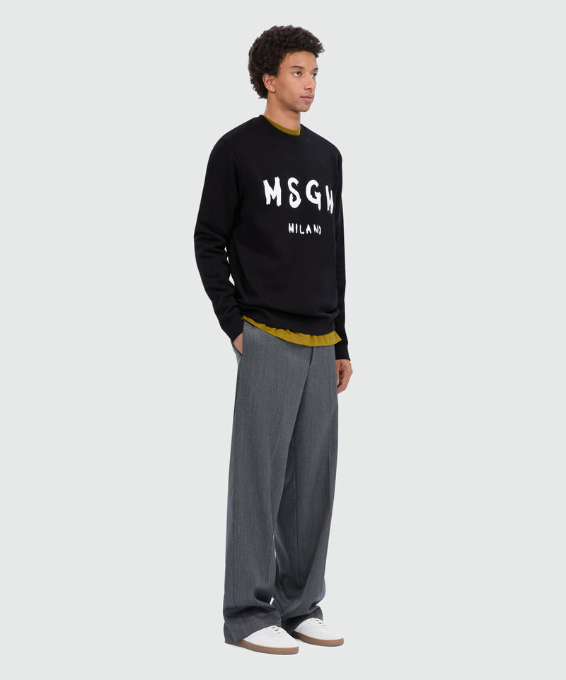 Felpa nera girocollo con logo pennellato 99 Uomo 