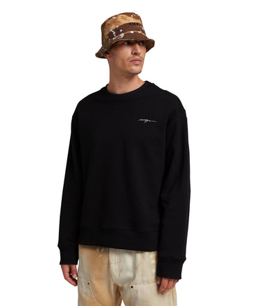 Cotton bucket hat with "dripping camo" print