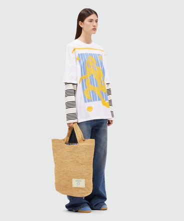 Tote bag in natural raffia and striped lining