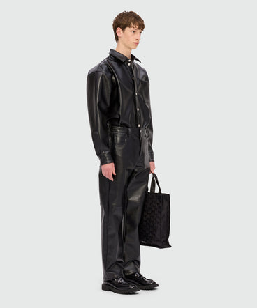 Black shirt with structured faux leather pocket