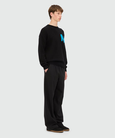 Black cashmere blend sweater with "TheMwave" patch