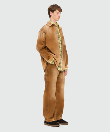 Beige spray-effect denim trousers