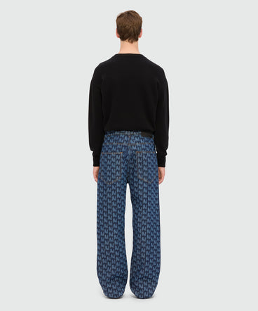 Blue laser-cut denim trousers with "TheMwave" motif