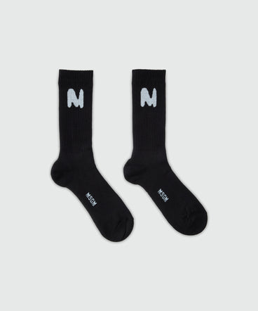 Black socks with "TheMwave" jacquard graphics
