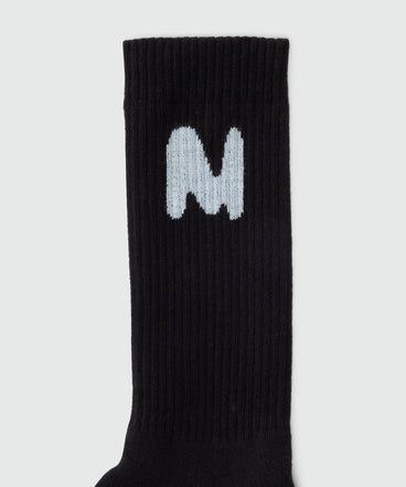 Black socks with "TheMwave" jacquard graphics
