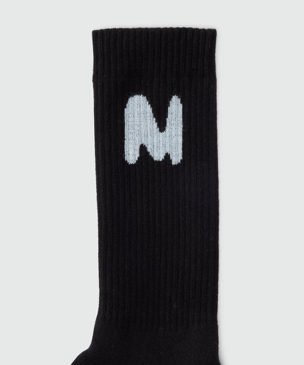 Black socks with "TheMwave" jacquard graphics