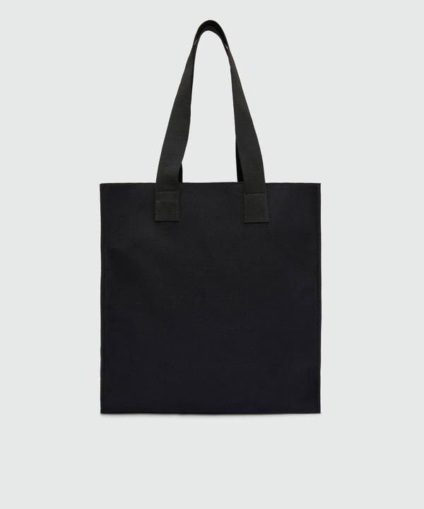 Black canvas tote with "Family Business" print