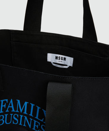 Black canvas tote with "Family Business" print