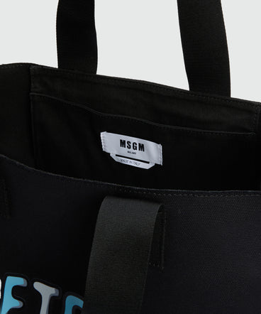Black canvas tote with "Softcore" print