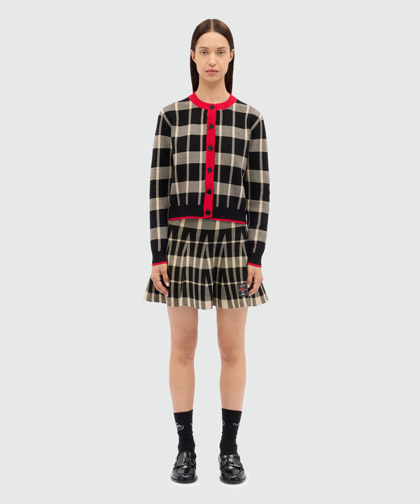 Black miniskirt in techno piquet with check pattern