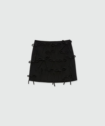 Black miniskirt in double crepe cady with bow detail