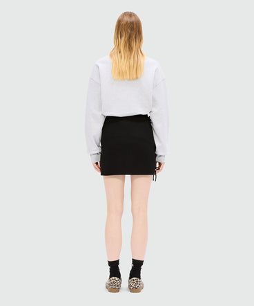 Black miniskirt in double crepe cady with bow detail