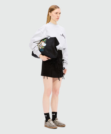 Black miniskirt in double crepe cady with bow detail