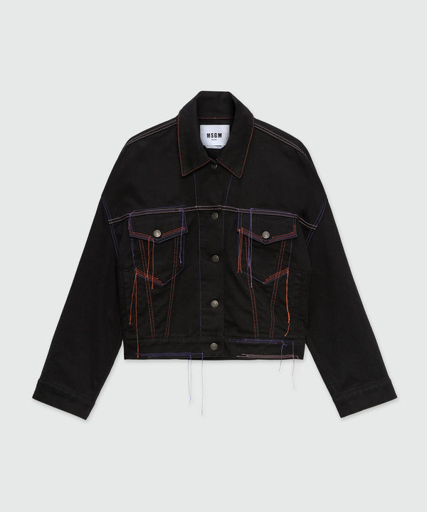 Black denim jacket with multi-colored stitching and threads