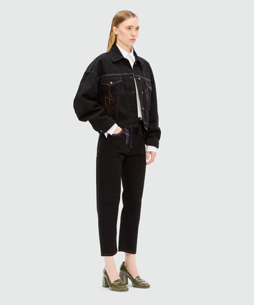 Black denim jacket with multi-colored stitching and threads