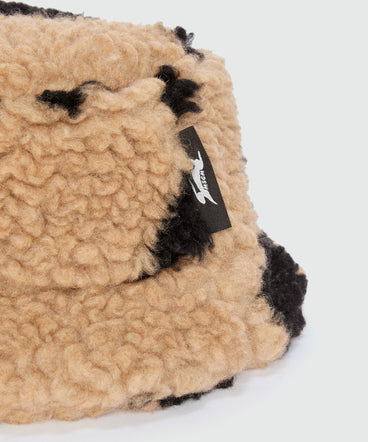 Beige teddy bucket hat with "Follow the Rabbit®" motif