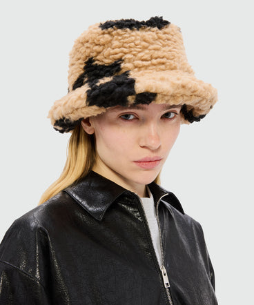 Beige teddy bucket hat with "Follow the Rabbit®" motif