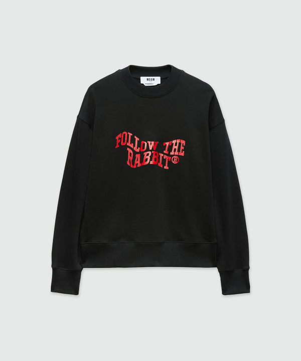 Black jersey sweatshirt with "Follow the Rabbit®" quote