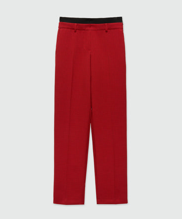 Red trousers with check pattern