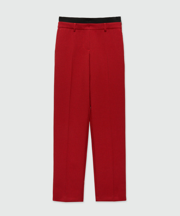 Red trousers with check pattern