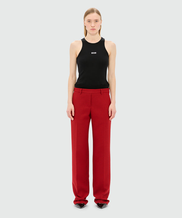 Red trousers with check pattern