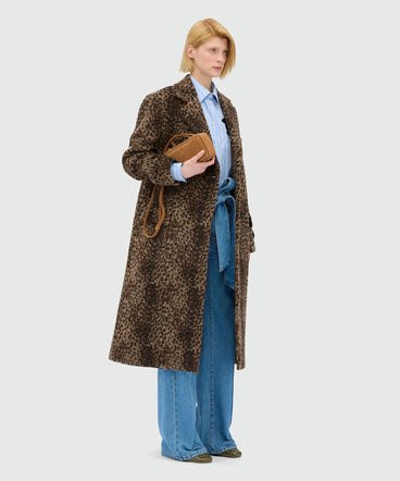 High-waisted blue denim trousers with belt