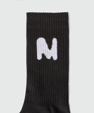 Black socks with "TheMwave" jacquard graphics