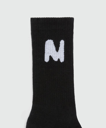 Black socks with "TheMwave" jacquard graphics
