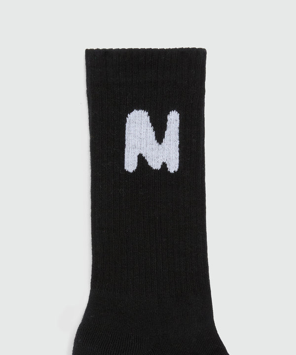 Black socks with "TheMwave" jacquard graphics