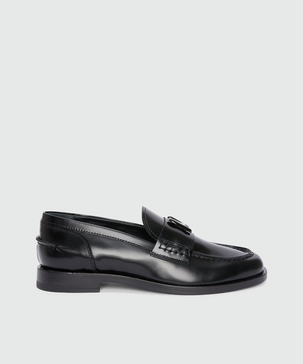 Black leather loafers with "TheMwave" applique