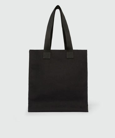 Black canvas tote with "Family Business" print