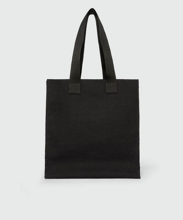 Black canvas tote with "Family Business" print