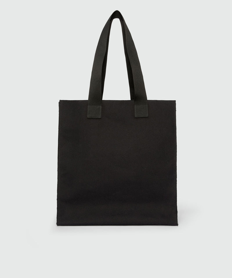 Black canvas tote with "Family Business" print 99 Women 