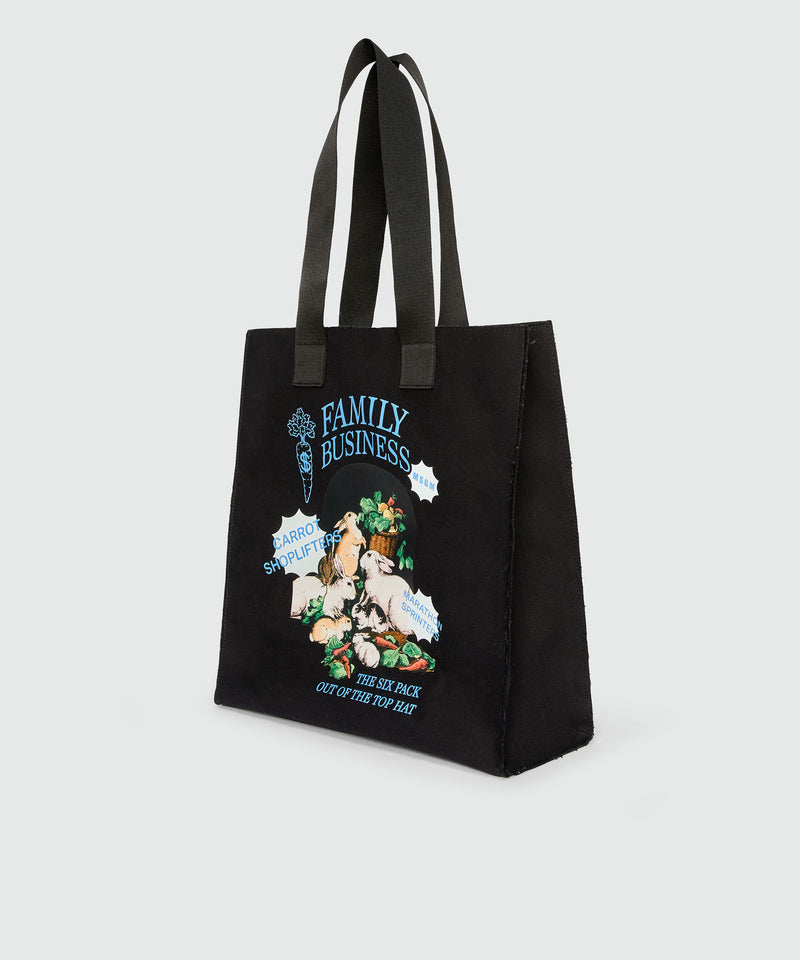 Black canvas tote with "Family Business" print 99 Women 