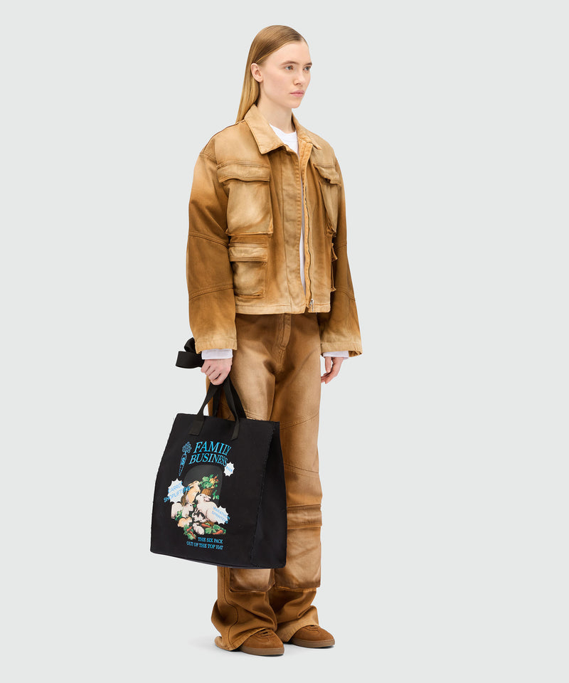 Black canvas tote with "Family Business" print 99 Women 