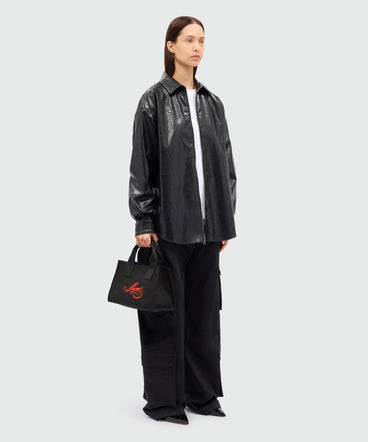 Black canvas micro tote with red cursive MSGM logo