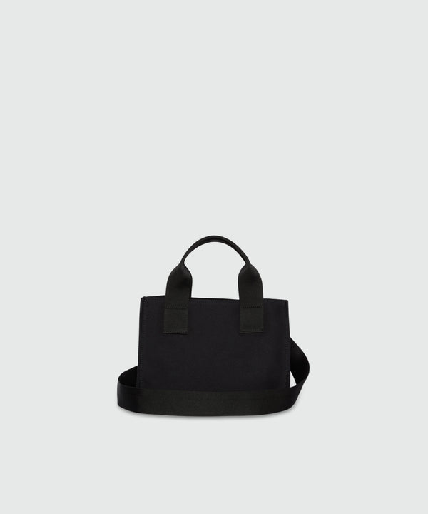 Black canvas micro tote with white cursive MSGM logo