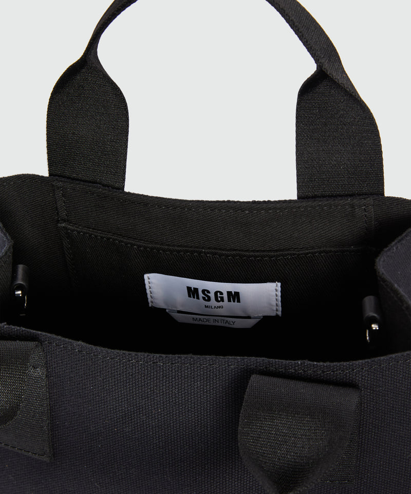 Black canvas micro tote with "TheMwave" logo 99 Women 