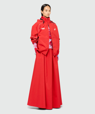 Long red nylon skirt with contrasting piping