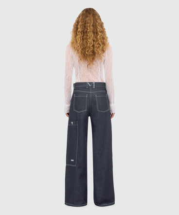 Blue raw denim trousers with zip at the bottom