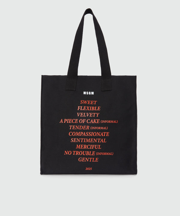 Black canvas tote with "Soft" print and lettering