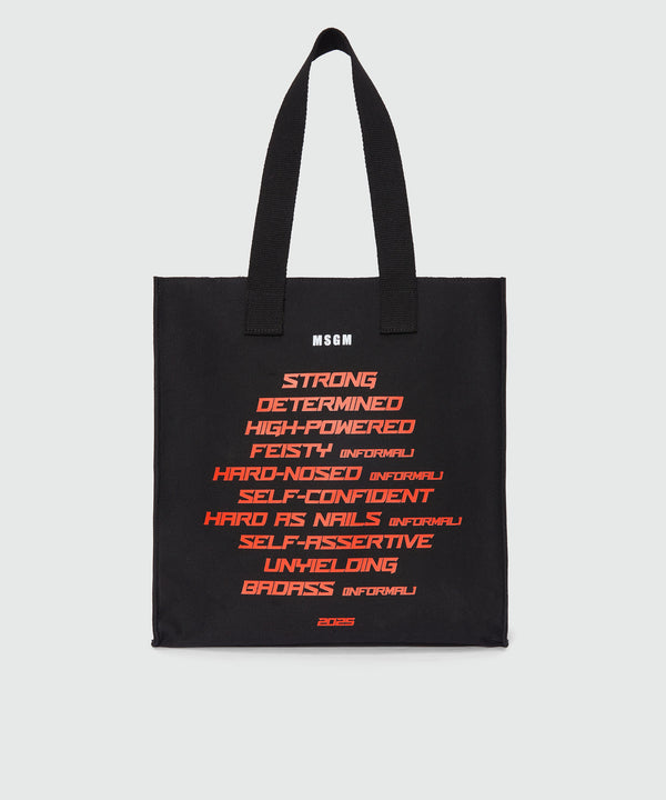 Black canvas tote with "Tough" print and lettering