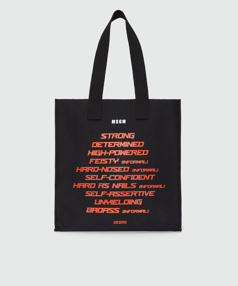Black canvas tote with "Tough" print and lettering 99 Women 