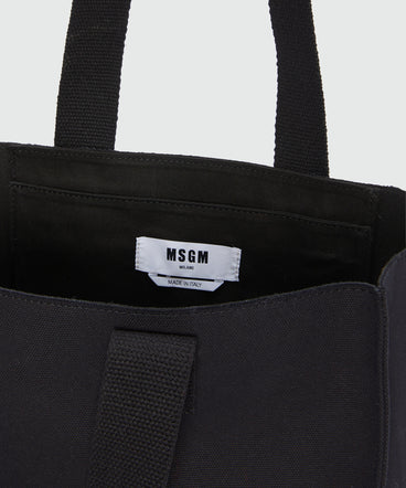 Black canvas tote with "Tough" print and lettering