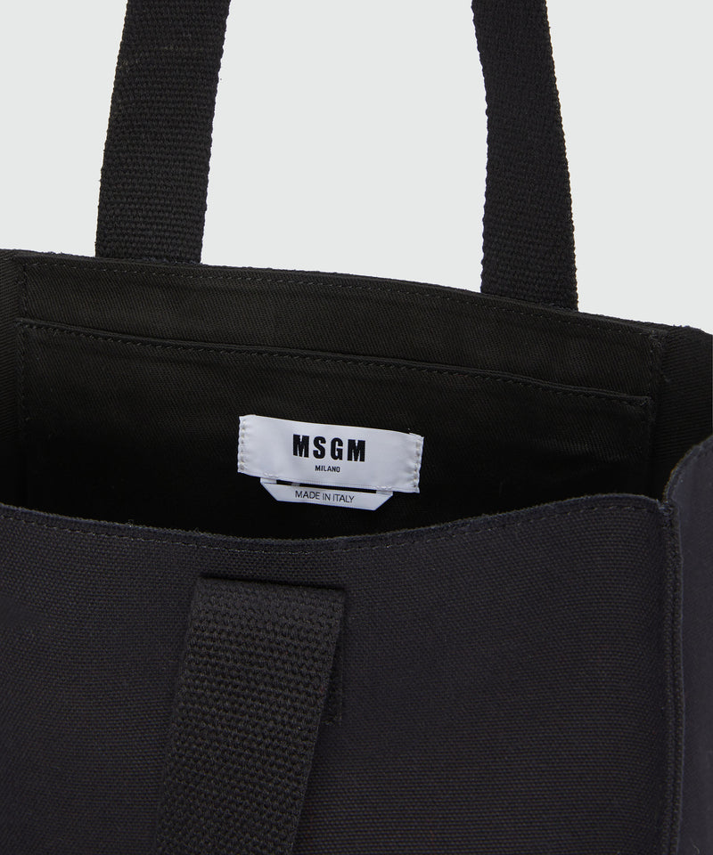 Black canvas tote with "Tough" print and lettering 99 Women 