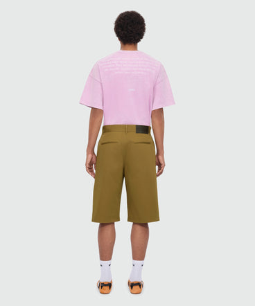 Military green cotton gabardine Bermuda shorts with wide legs and patch pockets on the leg.