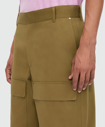 Military green cotton gabardine Bermuda shorts with wide legs and patch pockets on the leg.