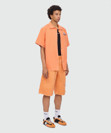 Orange cotton canvas Bermuda shorts with enzyme wash