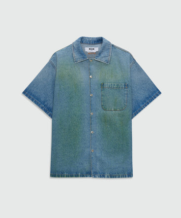 Light-wash denim short-sleeve shirt with localized distressing